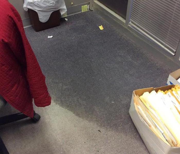 Water on carpeting in commercial office