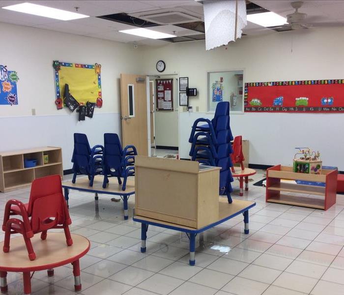 Kid's classroom with water on tile floor