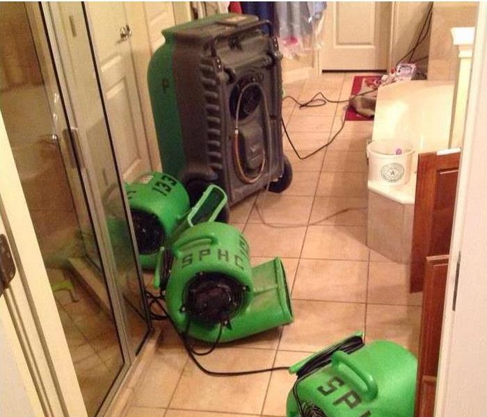 SERVPRO equipment on the kitchen floor