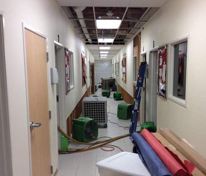 Water damage equipment in hallway